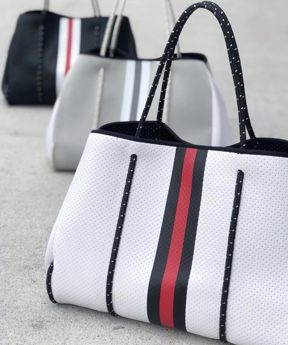 We have found the perfect bag for literally EVERYTHING. The Greyson Tote from Haute Shore makes for a great and casual everyday purse, perfect pool bag, or your next favorite travel accessory! We love how there are so many different colors and patterns that are sure to fit anyone’s personality!