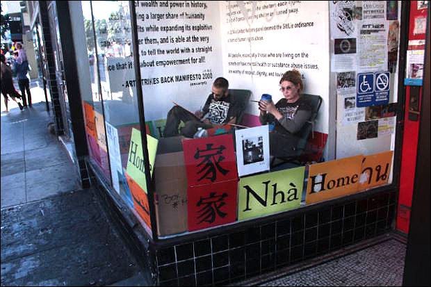 Christopher Statton and Megan Wilson painting inside ATA's storefront. Photo by Daniel Hirsch.