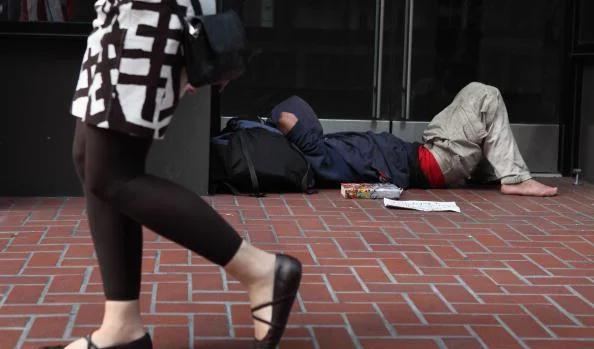 What To Do If You’re Concerned About A Homeless Person Sleeping In Your Doorway