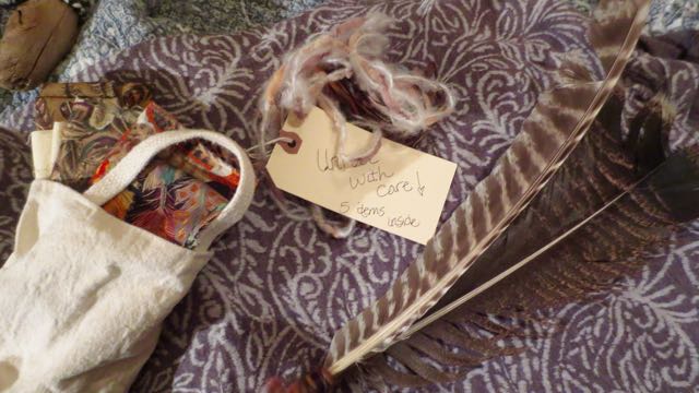The feathers and a collection of feather fabrics. The package also included the book, “The Perfect Purple Feather.” The book was an instant hit with the children.