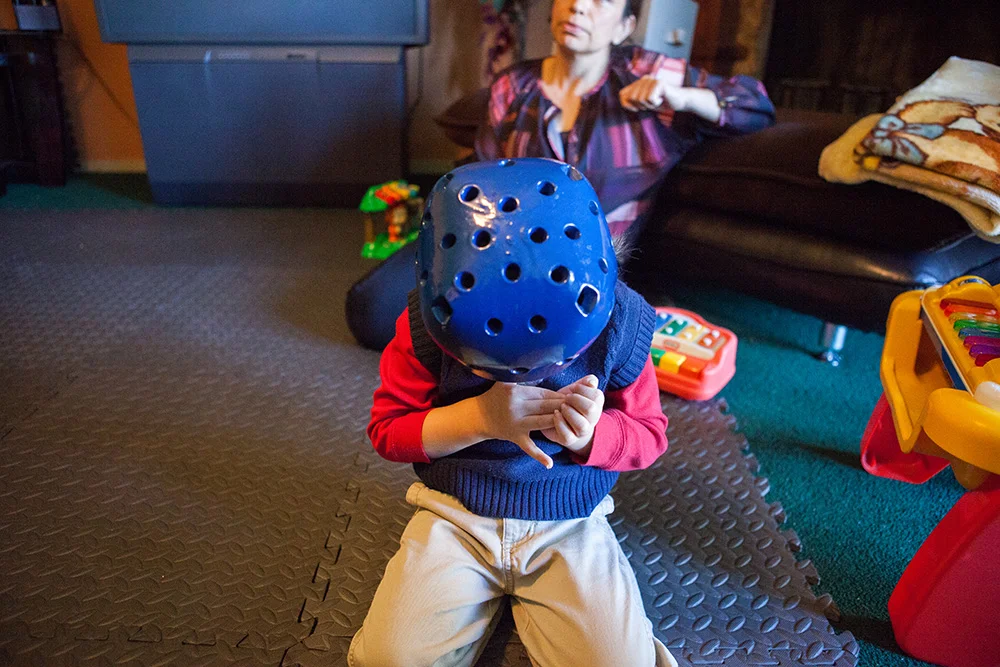  Head bowed, muscles and joints tense, Rikki experiences a seizure in which he remains upright and retains consciousness in his south Ft. Worth home. The carpeted floor of his play area is covered with foam mats to make sure he is protected should he