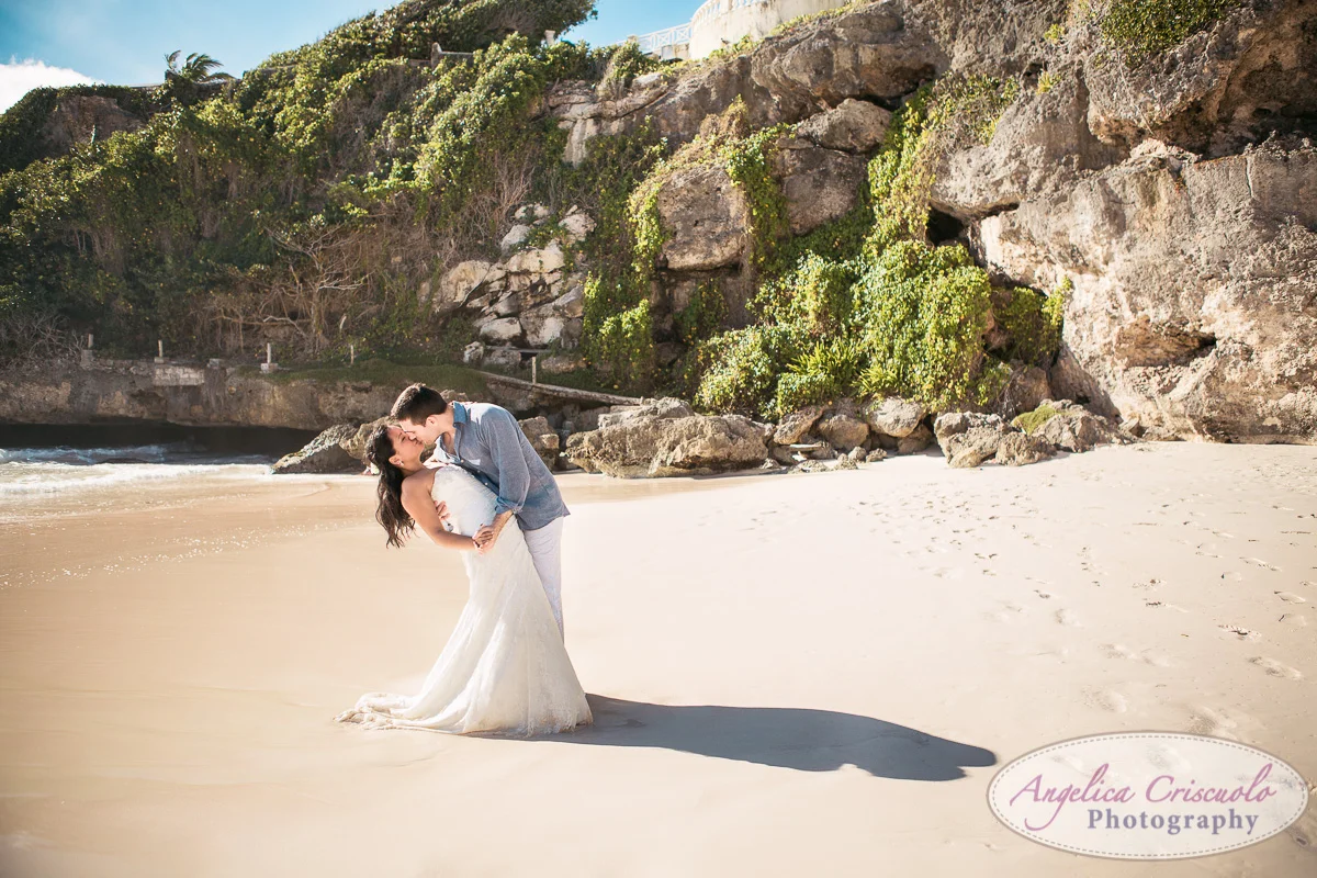 Destination Wedding photo kiss on beach dip the bride KristyPhilBarbadosWEB-1145