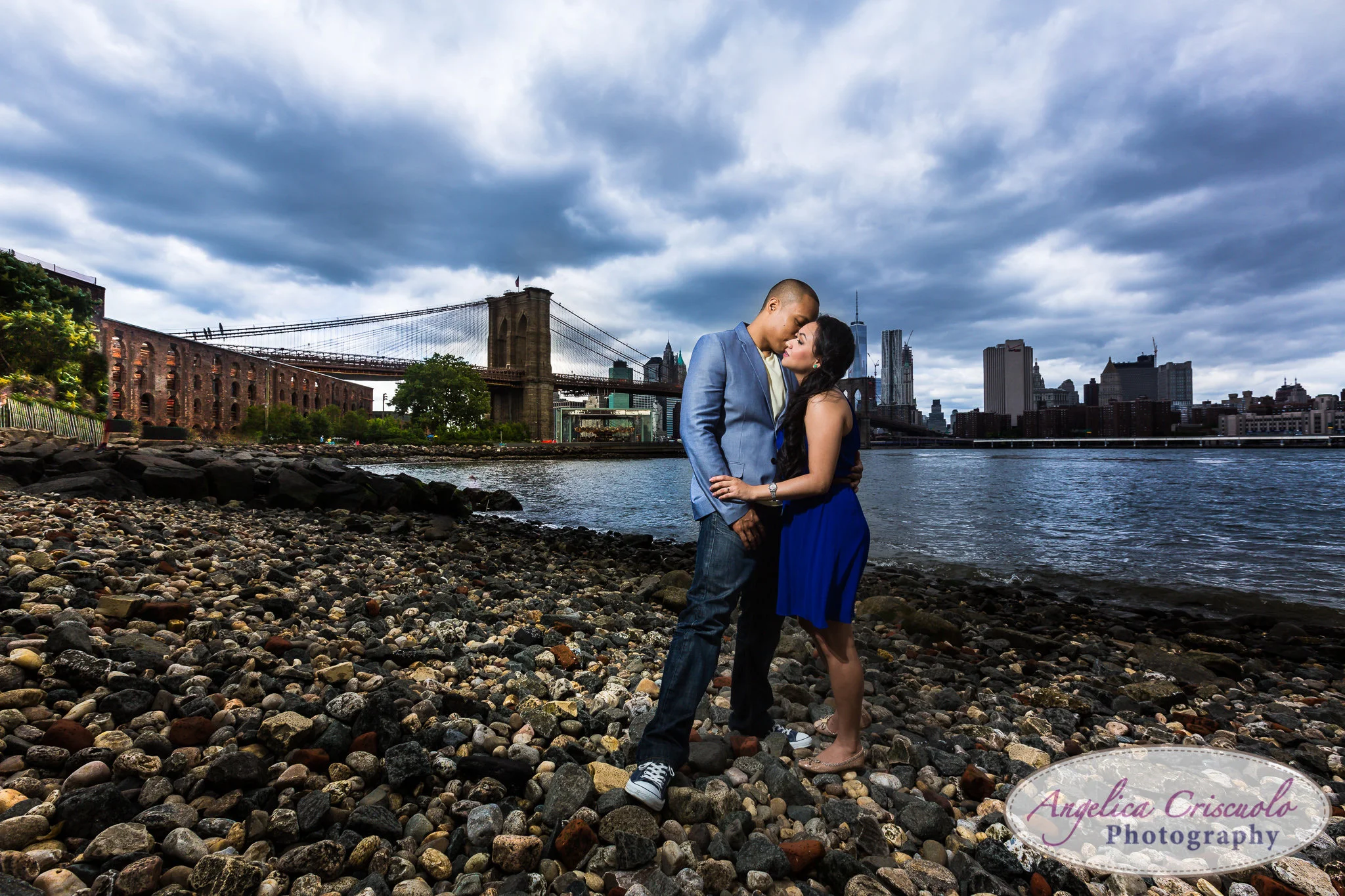 Brooklyn Bridge dramatic engagement photo on the beach