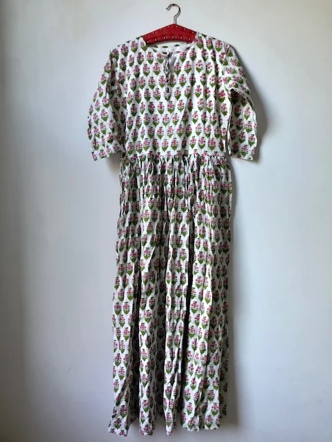 Dress with uncut hem.