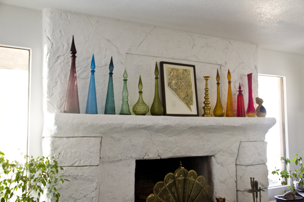 Mary Beth's amazing collection of vintage glass jars displayed with a topography map of Nevada.