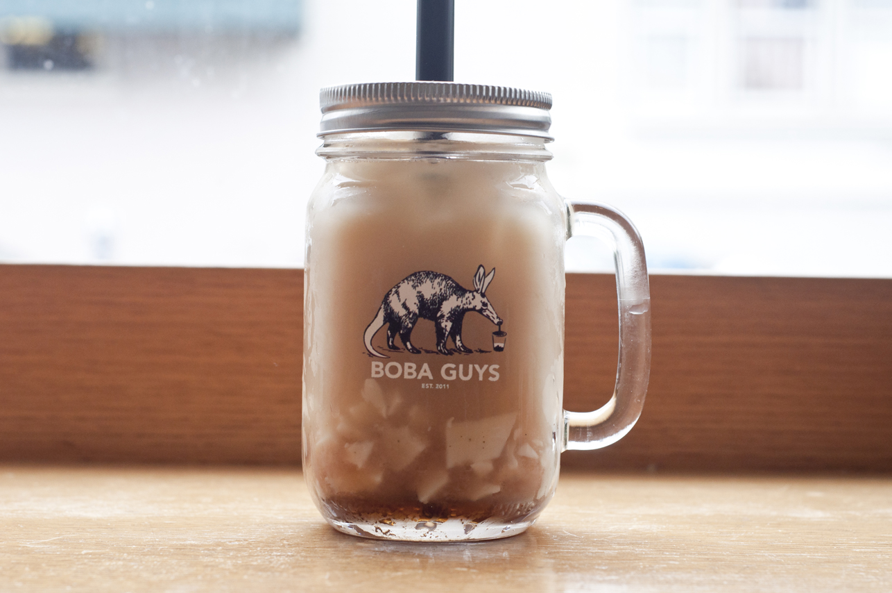 Jasmine milk tea with almond jelly in their signature mason jar mug.