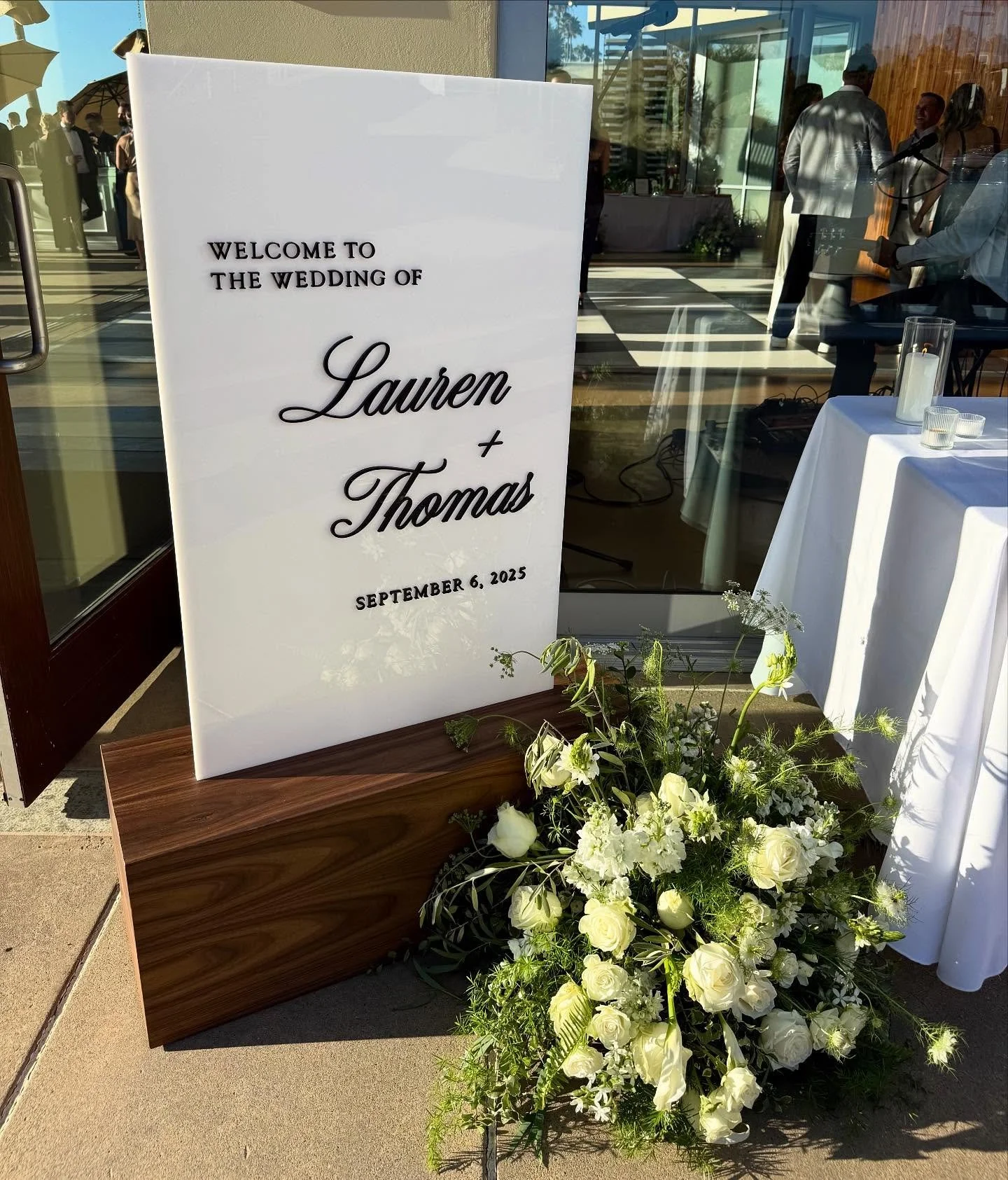 Still swooning over this welcome sign from last weekend&rsquo;s wedding. The walnut wood base, custom built by @cherokeepointwoodworks, is truly a work of art and turned out even better than I imagined. Paired with a sleek black-and-white acrylic sig