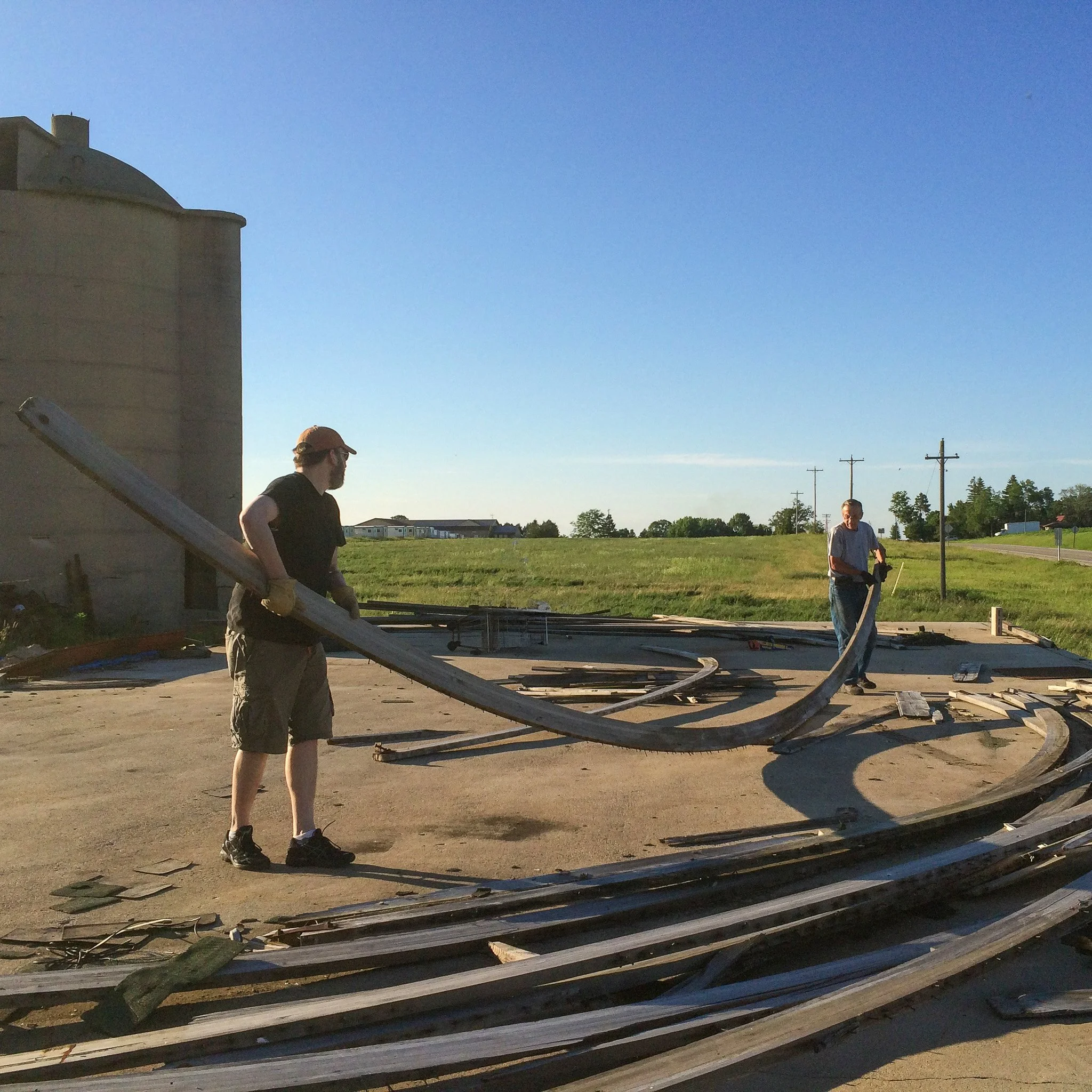 02-sourcing-curved-reclaimed-boards-near-grain-silo.jpg