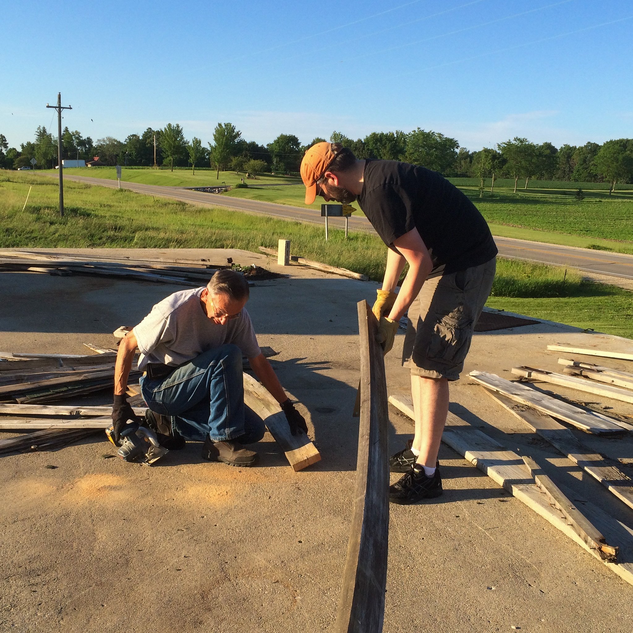 06-dad-and-son-inspecting-long-lumber-outdoors.jpg