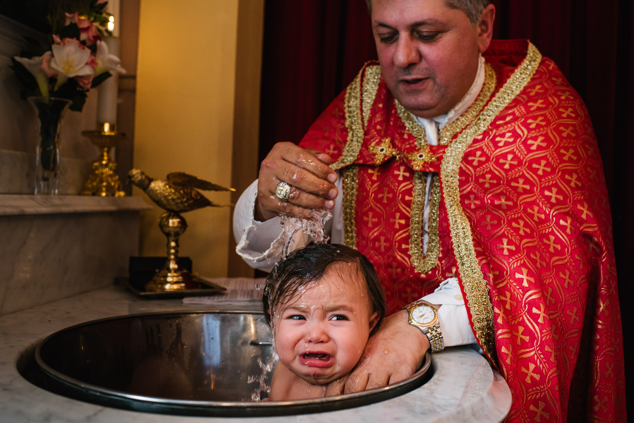 Baby being dunked orthodox christening