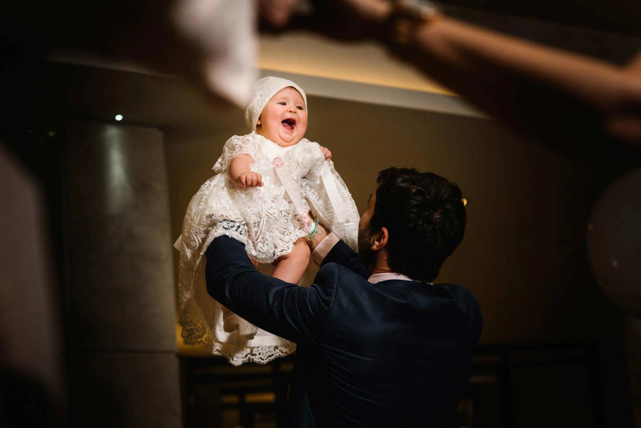 Baby smiling during dancing at La Montage christening reception