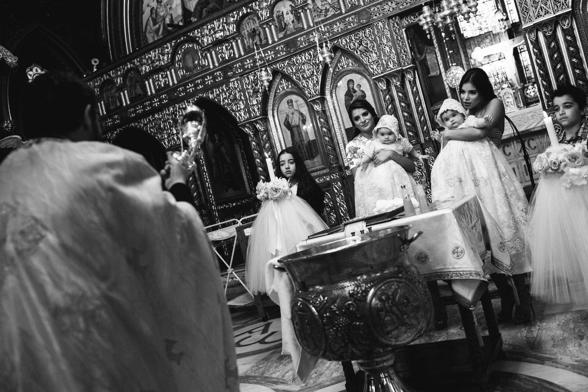 Babies and godmothers at Greek Orthodox christening