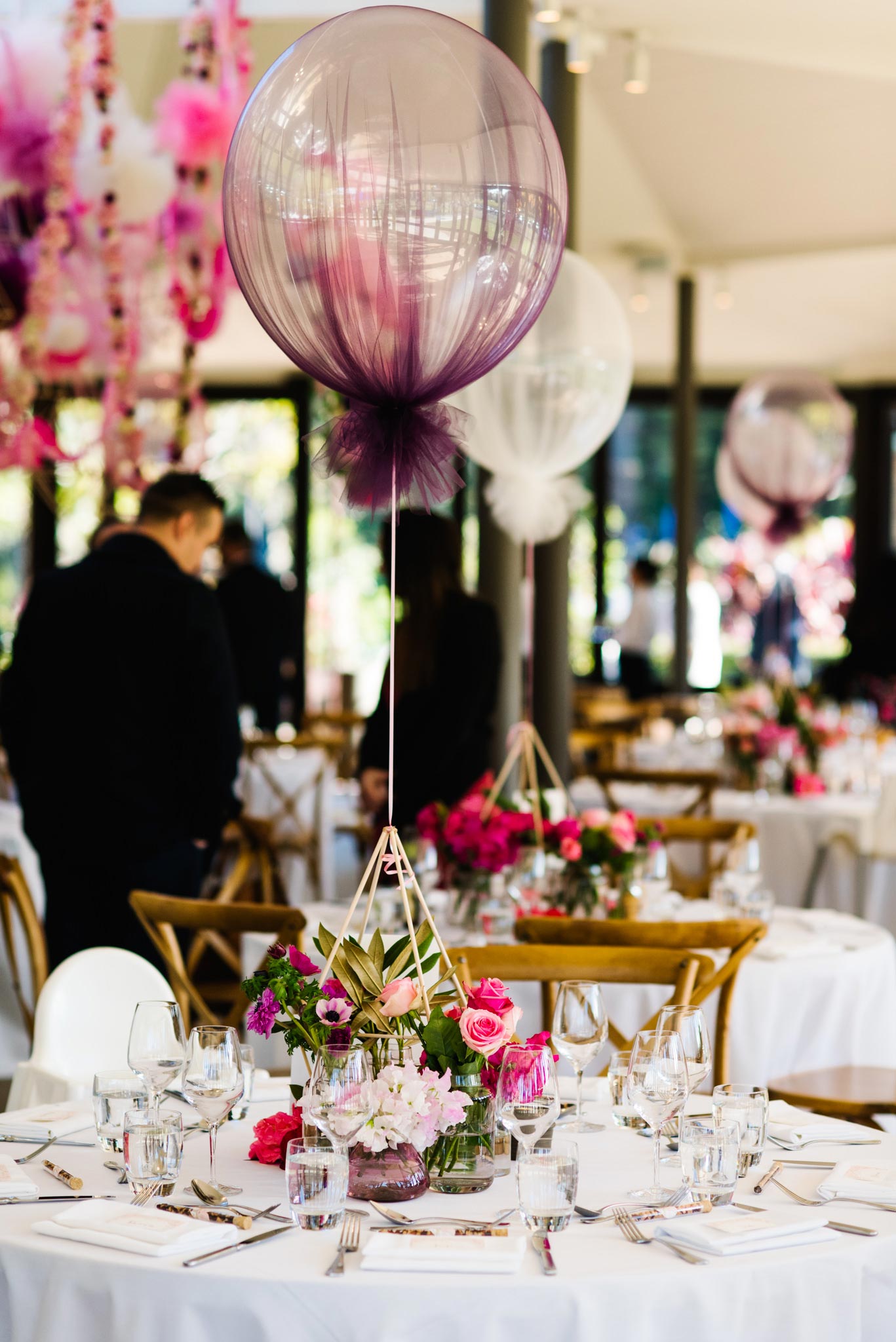 Detail of floral pink and purple christening table decor