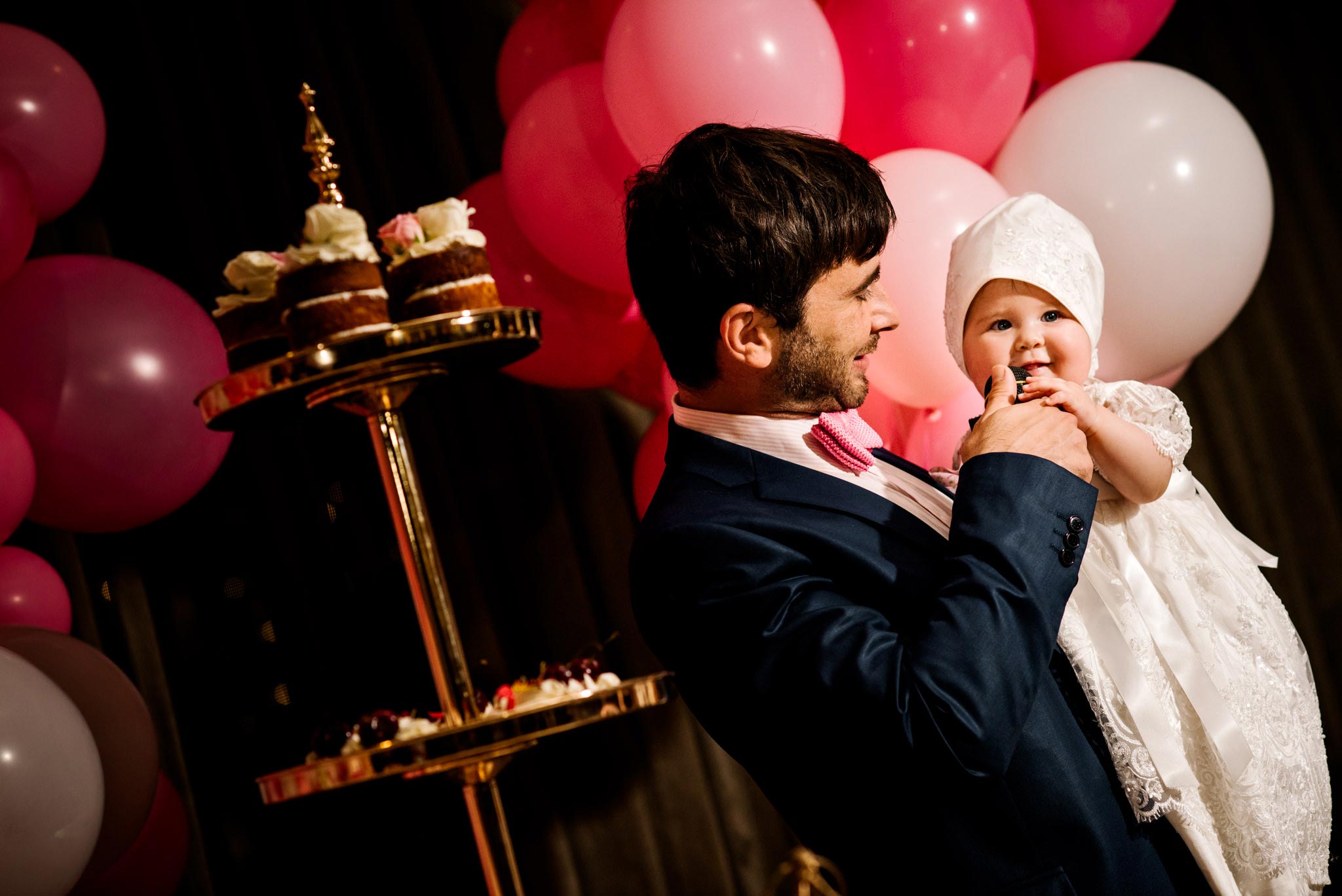 Godfather and baby during christening speeches