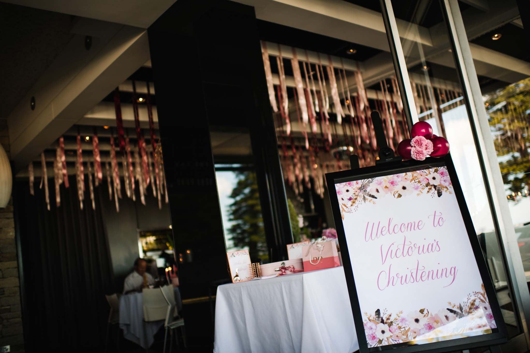 Sign at entry to christening party at Bianco Restaurant