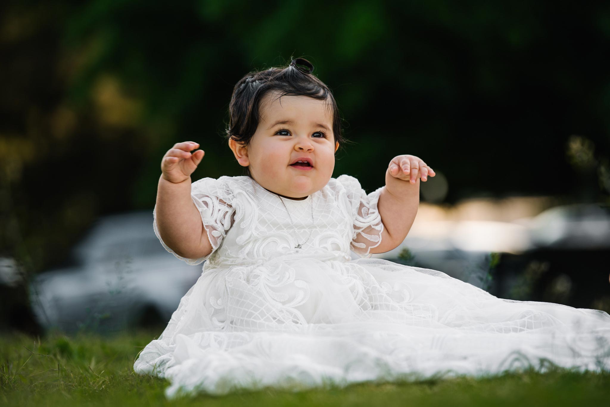Cute baby in christening gown at Oliveto Ristorante