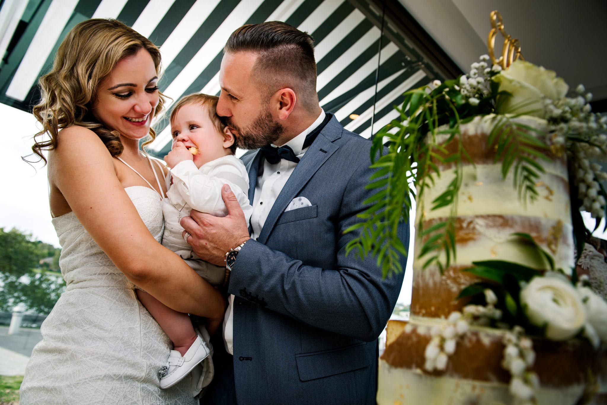Baby eats christening cake at Oliveto reception
