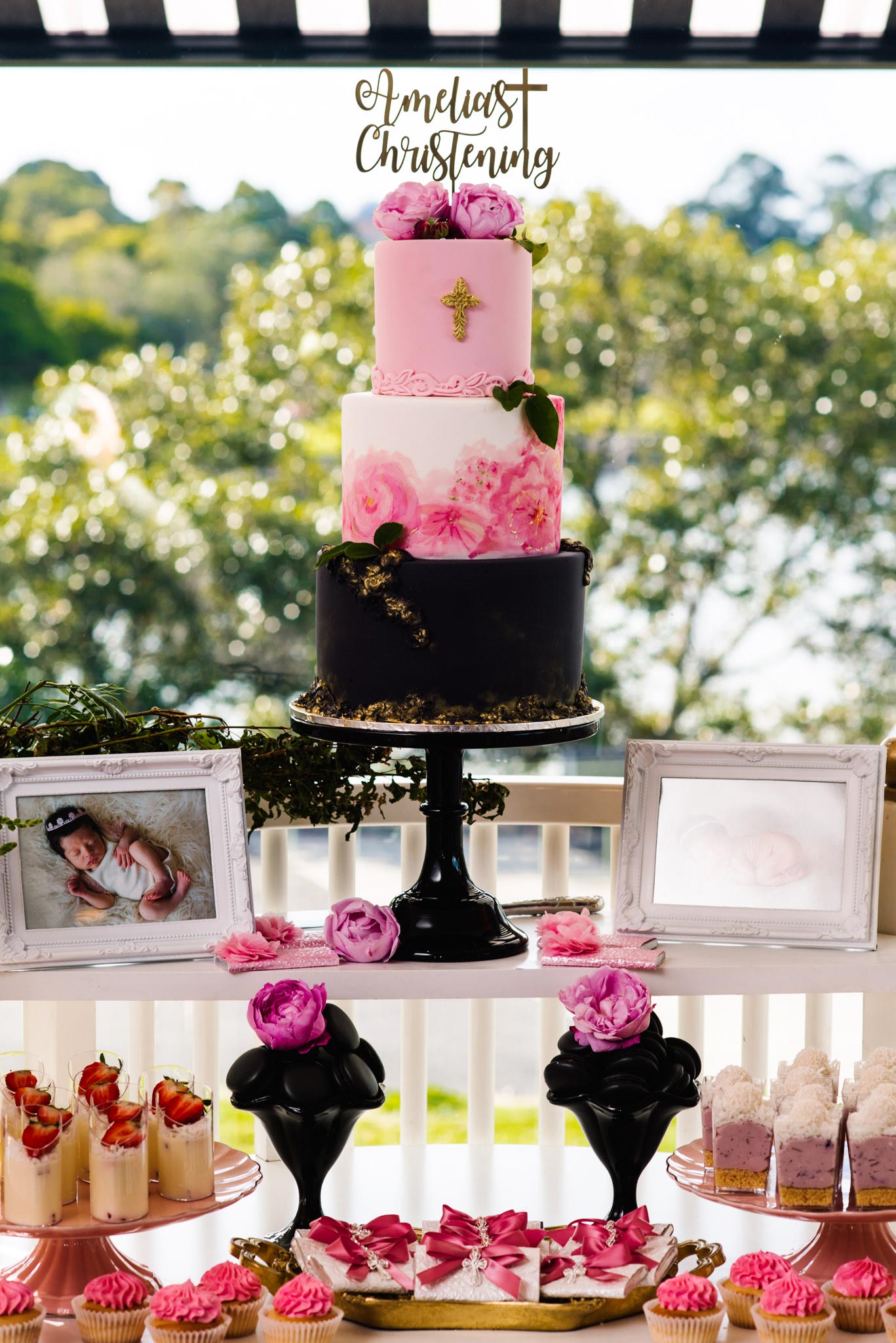 Pink, black and white christening cake at Oliveto Sydney