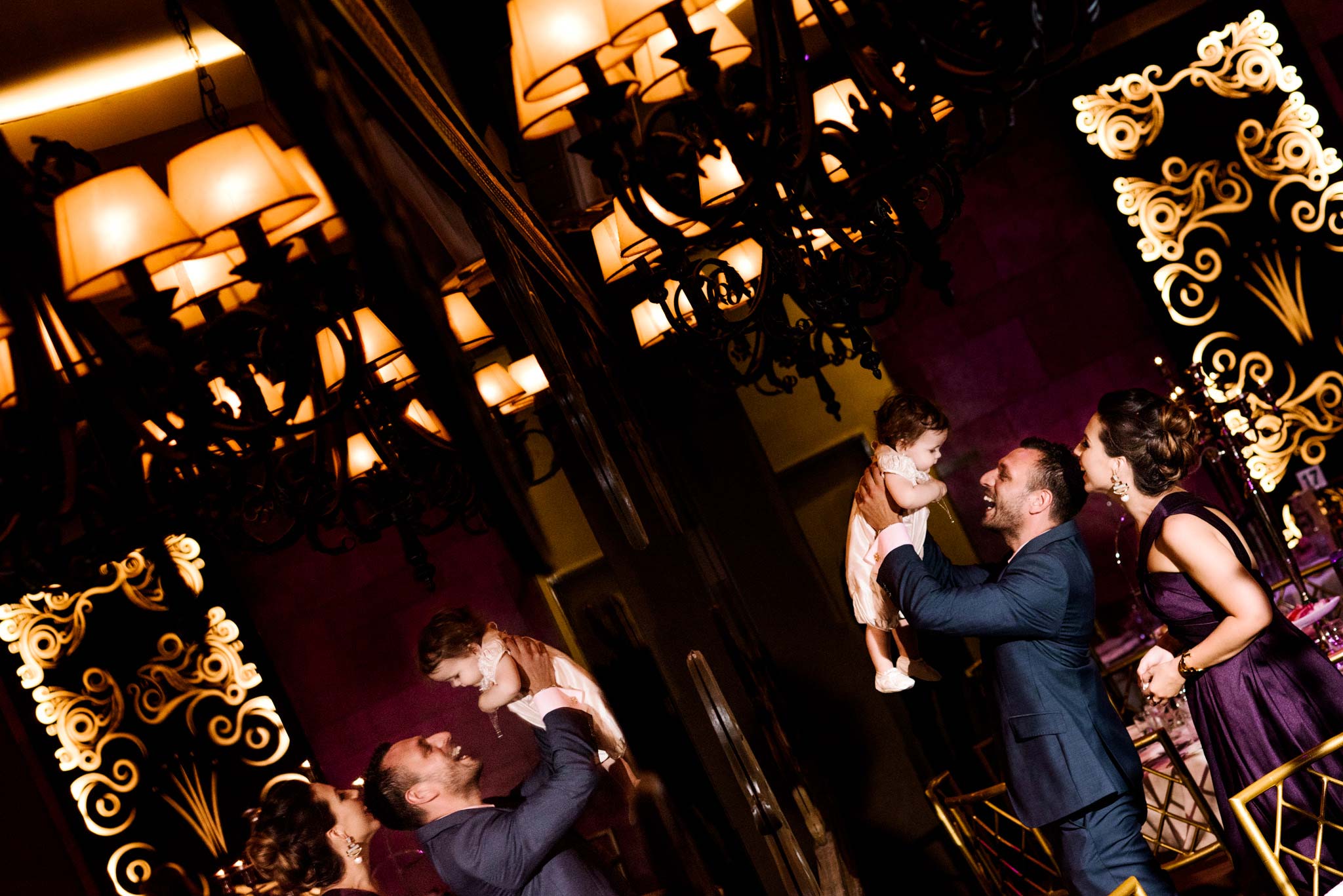 Dramatic reflection portrait of family at Clarence House Christening venue