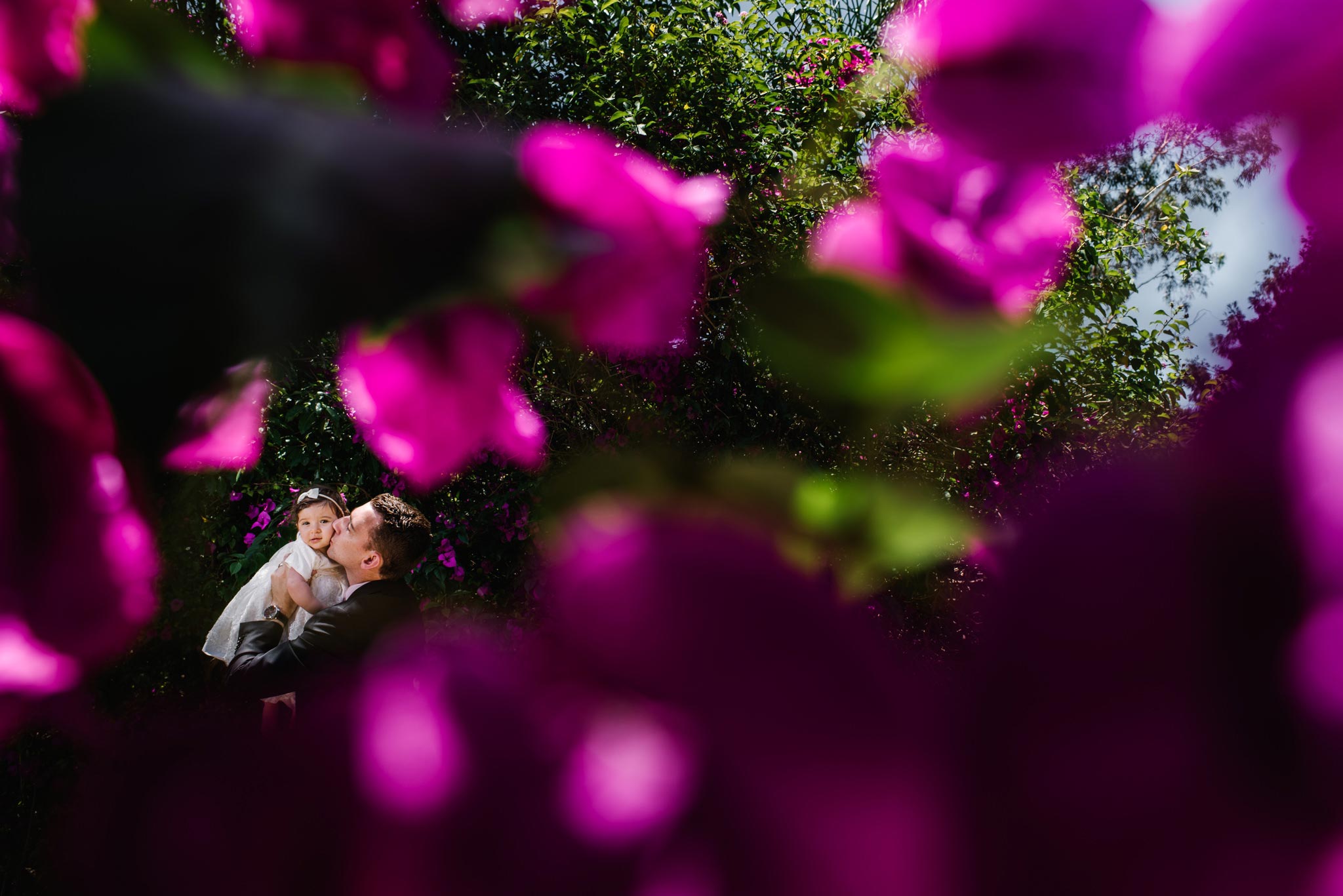 Father and daughter in gardens at Oatlands House christening venue