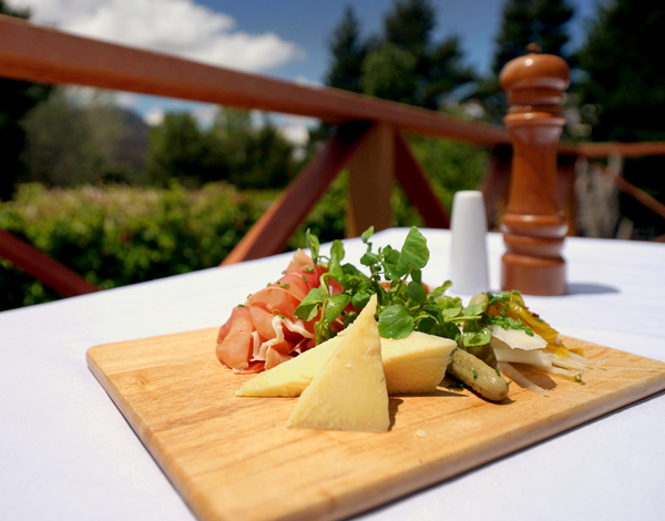 Cheese platter served in the garden at Crackenback Farm