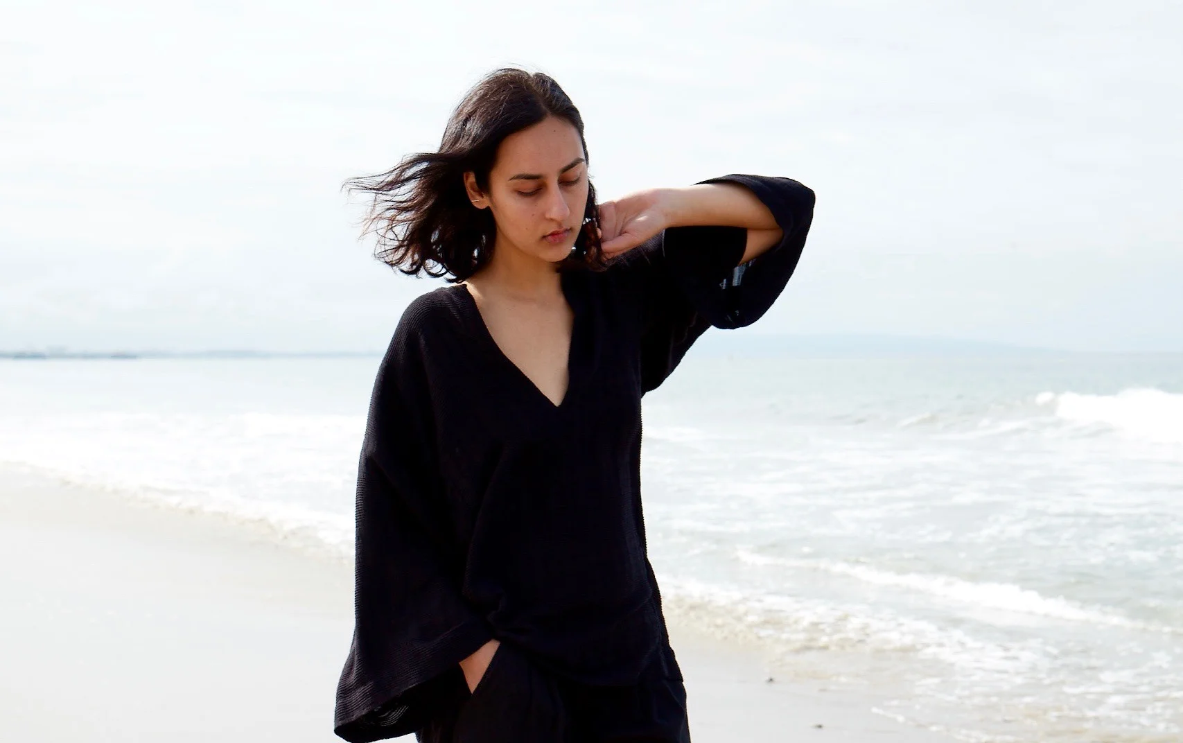 Perwana wears the Sunday Caftan Short in Creme