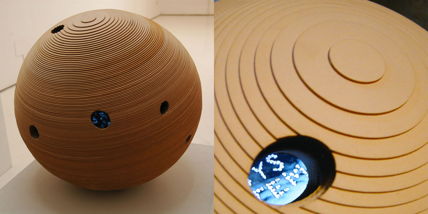 Miniverse 1 , 2008 Layered wooden sphere 45 cm / 18 inches diameter. 5 video screens embedded, 10 synchronized videos, 2.30min each.