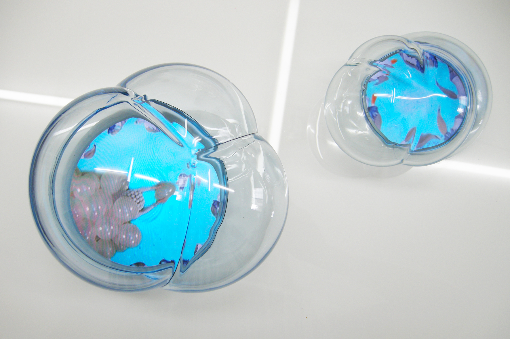 How blue can smoke be? collaboration with Saori Tsukada 2-screen video composition, 6:05 min, looped hand-blown glass bubbles, video screen embedded in white acrylic 20 x 15 x 14 in / 51 x 38 x 35 cm