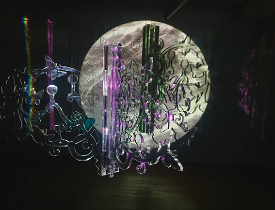 Butterfly Rainbowmaker 2016 video projection, rotating clear acrylic glass sculpture, suspended from ceiling projector, media player, and speaker