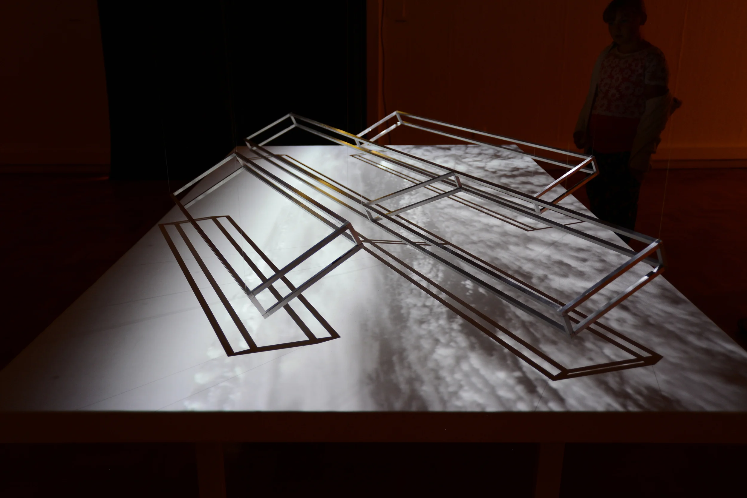 Air-toAir (Pitched Formation), 2015, aluminium frames, screen and moving image projection. Installation view.