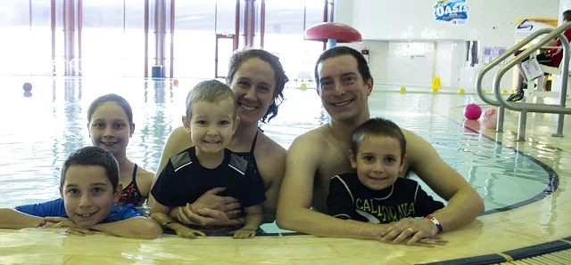 Wellness has become a way of life for the Jones family, who joined Greater Midland six years ago. Parents Tara and Travis Jones love to swim at the Community Center's Oasis Pool with their children (from left), Malachi, Nala, Kaemon and Levi.