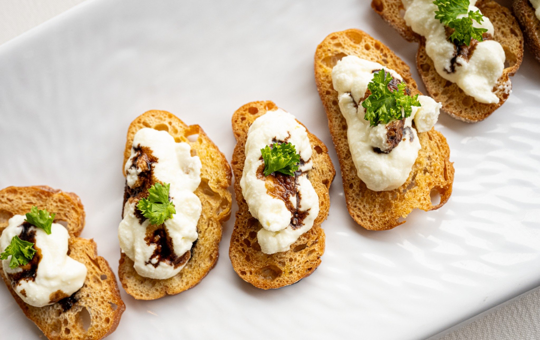 Indulge in the art of small bites with Actual Food Nashville. Our hors d'oeuvres are crafted to delight every palate, offering a wide variety of flavors and textures. From savory to sweet, there's something for everyone to enjoy. Let's elevate your e