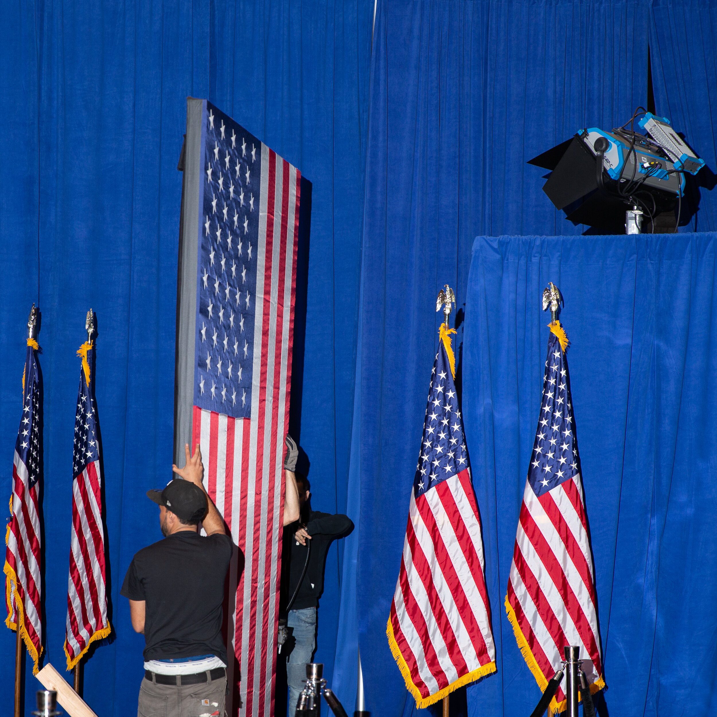 Staff breakdown props at Michael Bloomberg's final campaign appearance. This event was one of the last in-person events before campaigning came to a halt due to COVID-19