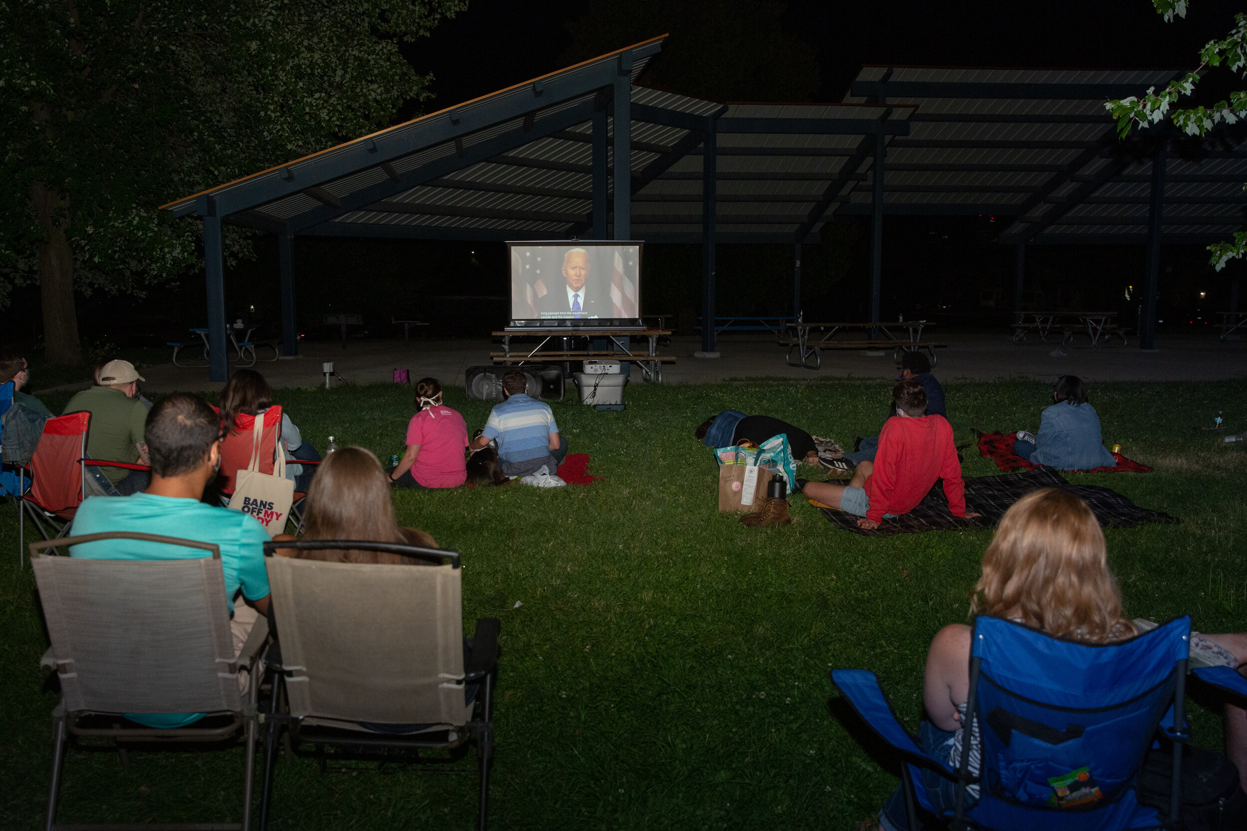 Attendees Watch The Final Night Of The  2020 Democratic National Convention At A Socially Distanced Outdoor Watch Party