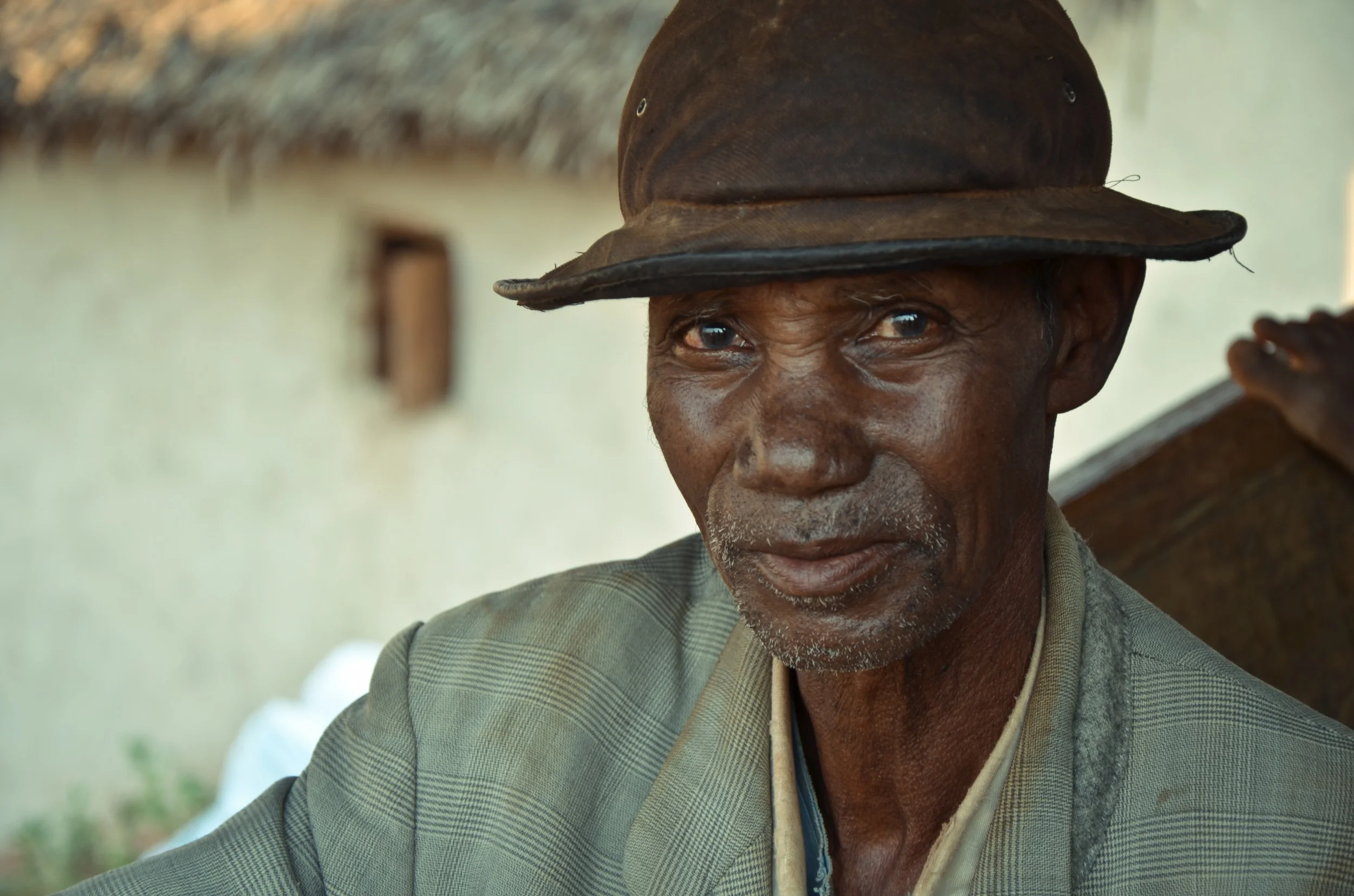 A farmer in northeastern Madagascar with several lavaka on his land. Photo: Alizé Carrère