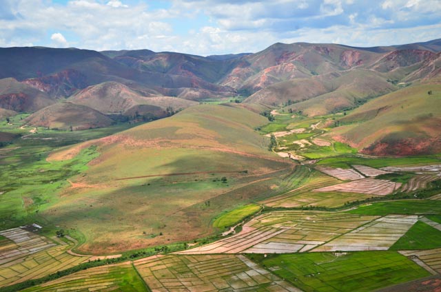 Natural highlands contrasted against the agricultural works of the human hand. Photo: Alizé Carrère