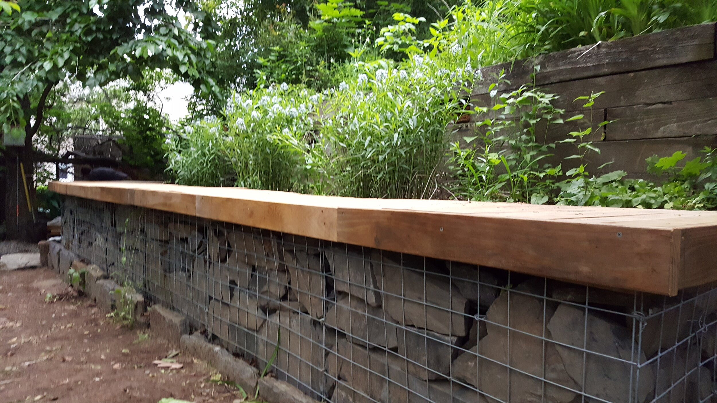 A retaining wall that is low cost and low maintenance