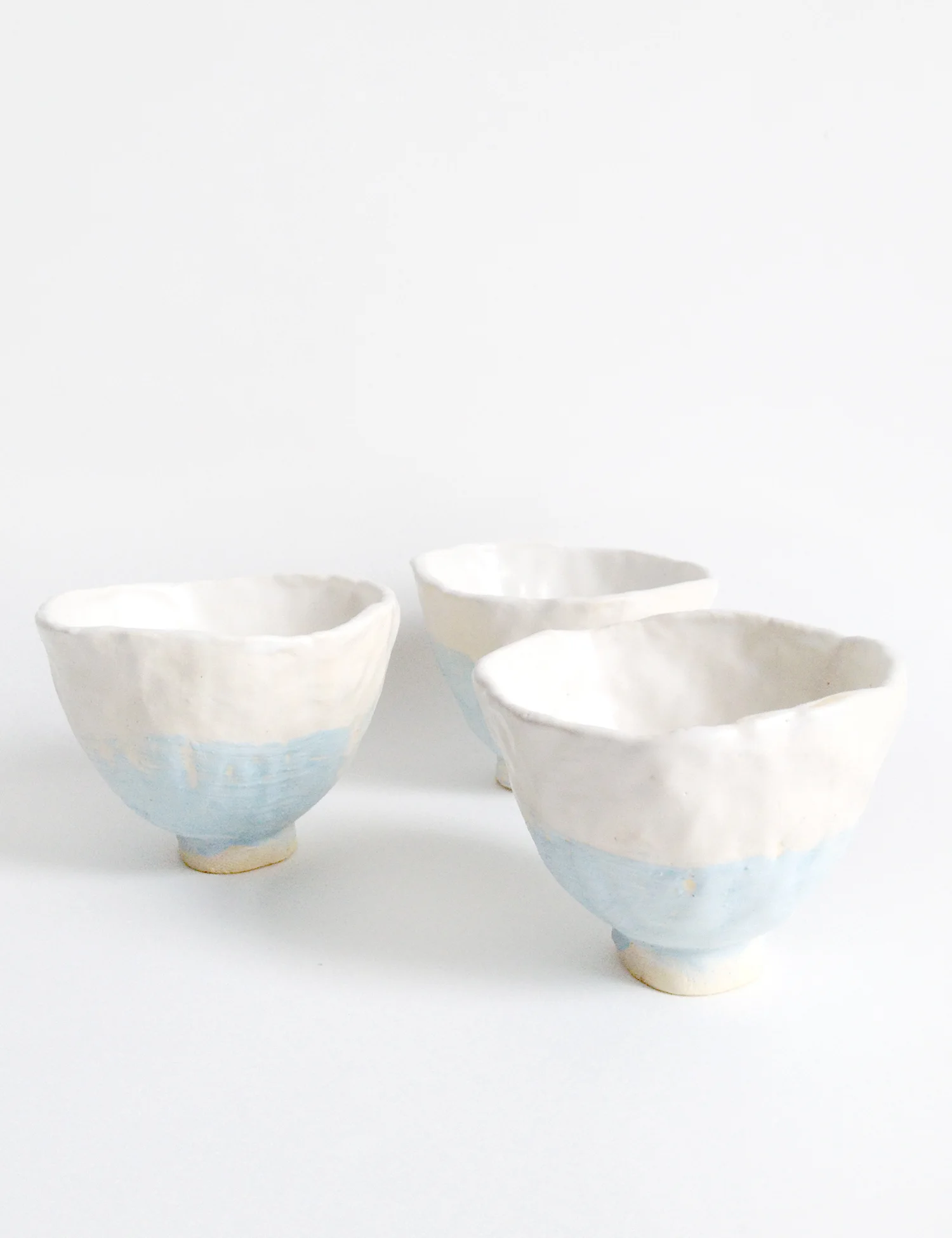 Light blue and white tea bowls
