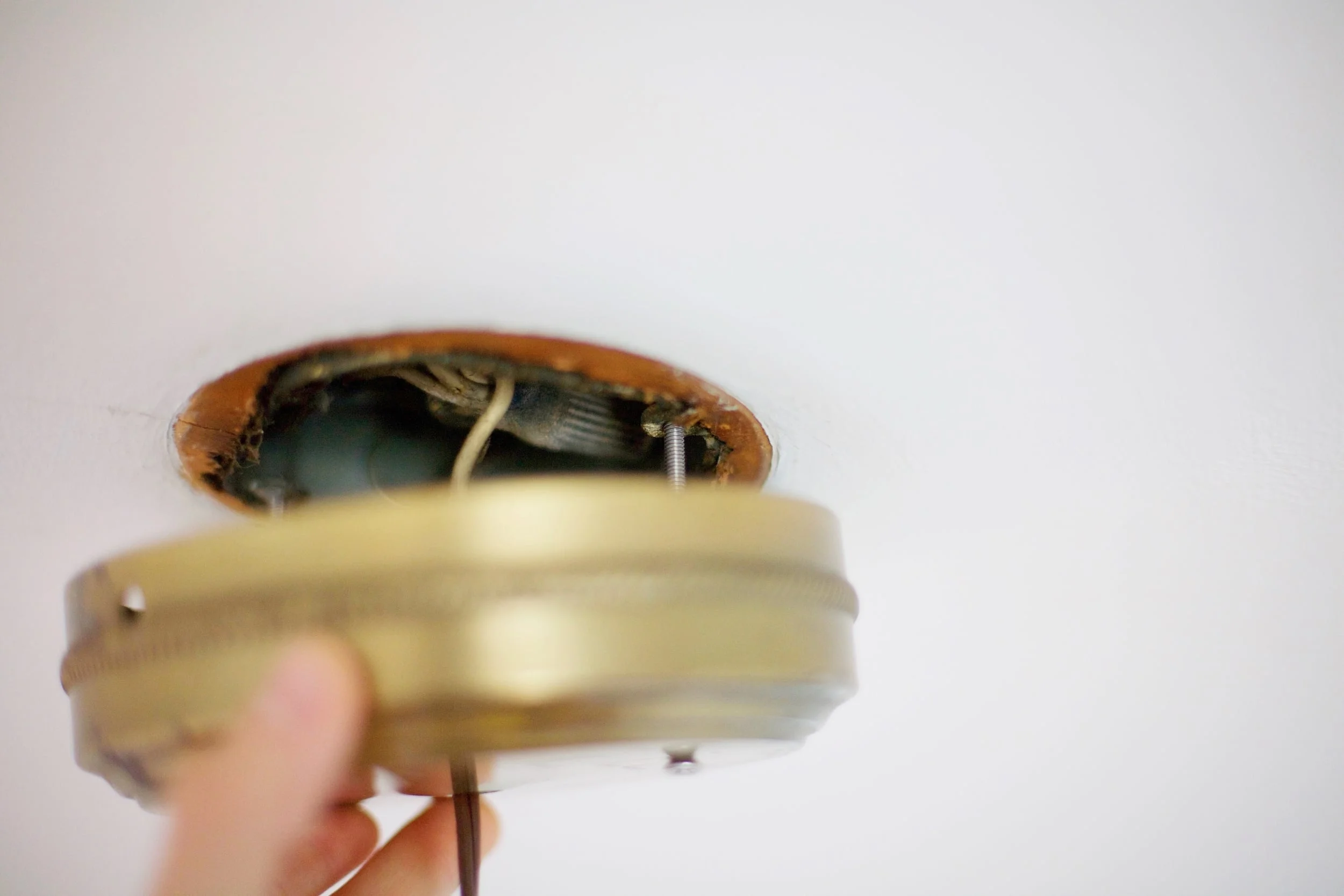 7. Simply wire your hot and neutral wires (Make sure your light switch is off and taped off so no one accidentally sneaks up on you). Then, line up your screws with the holes in the box and