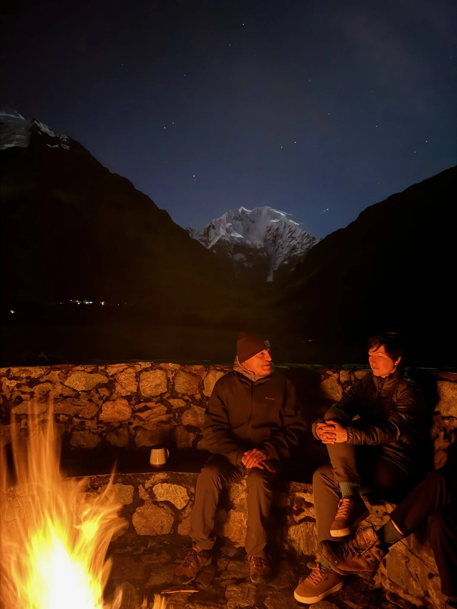 Campfire with moonlight on Mt. Salcantay