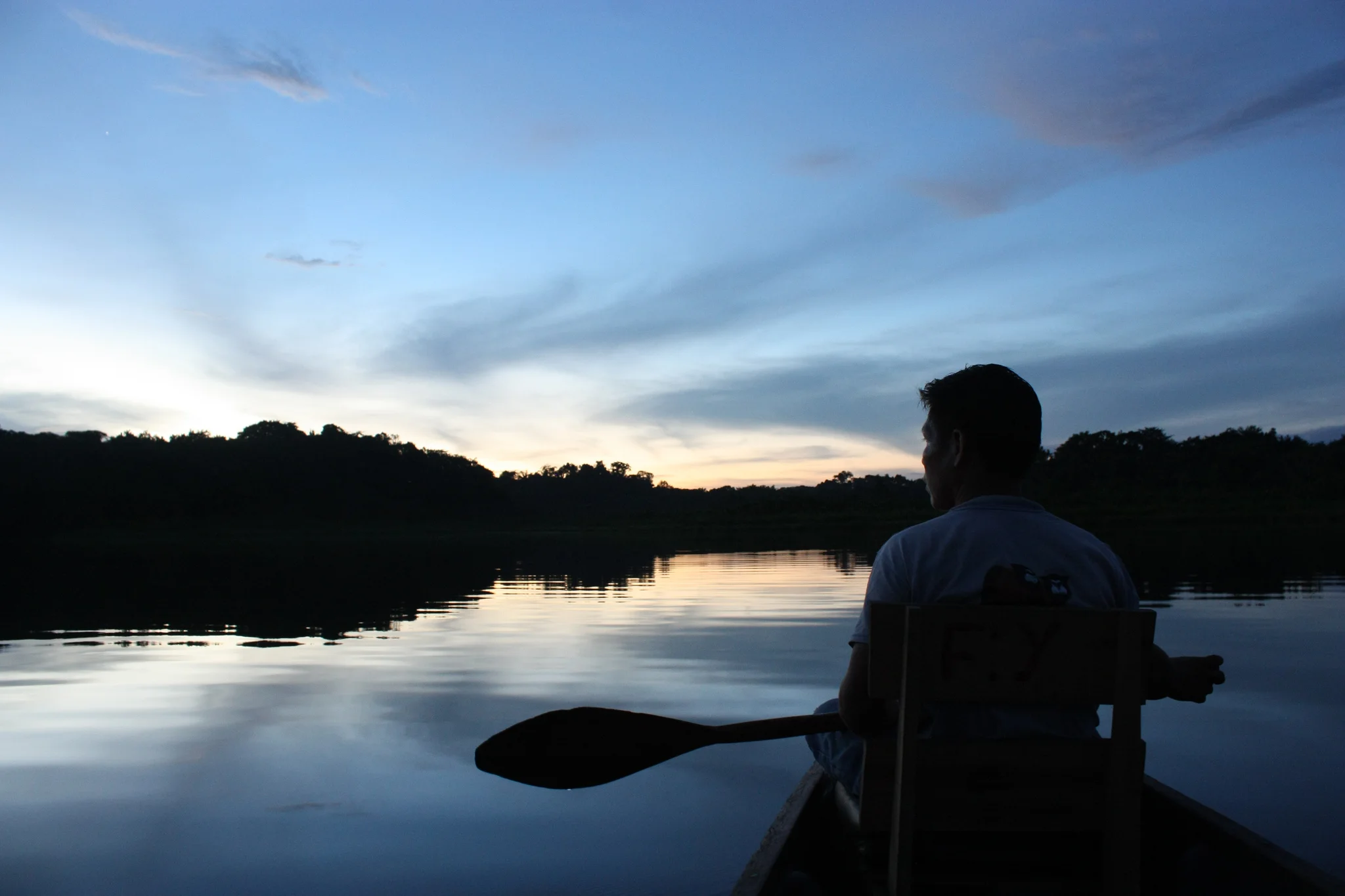 Paddling a canoe on the river