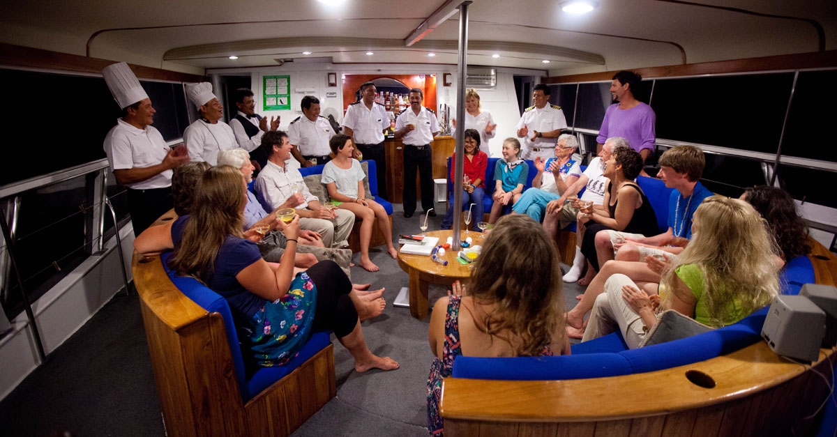 Celebrating in the Galápagos aboard Reina Silvia . Photo © Weston Walker