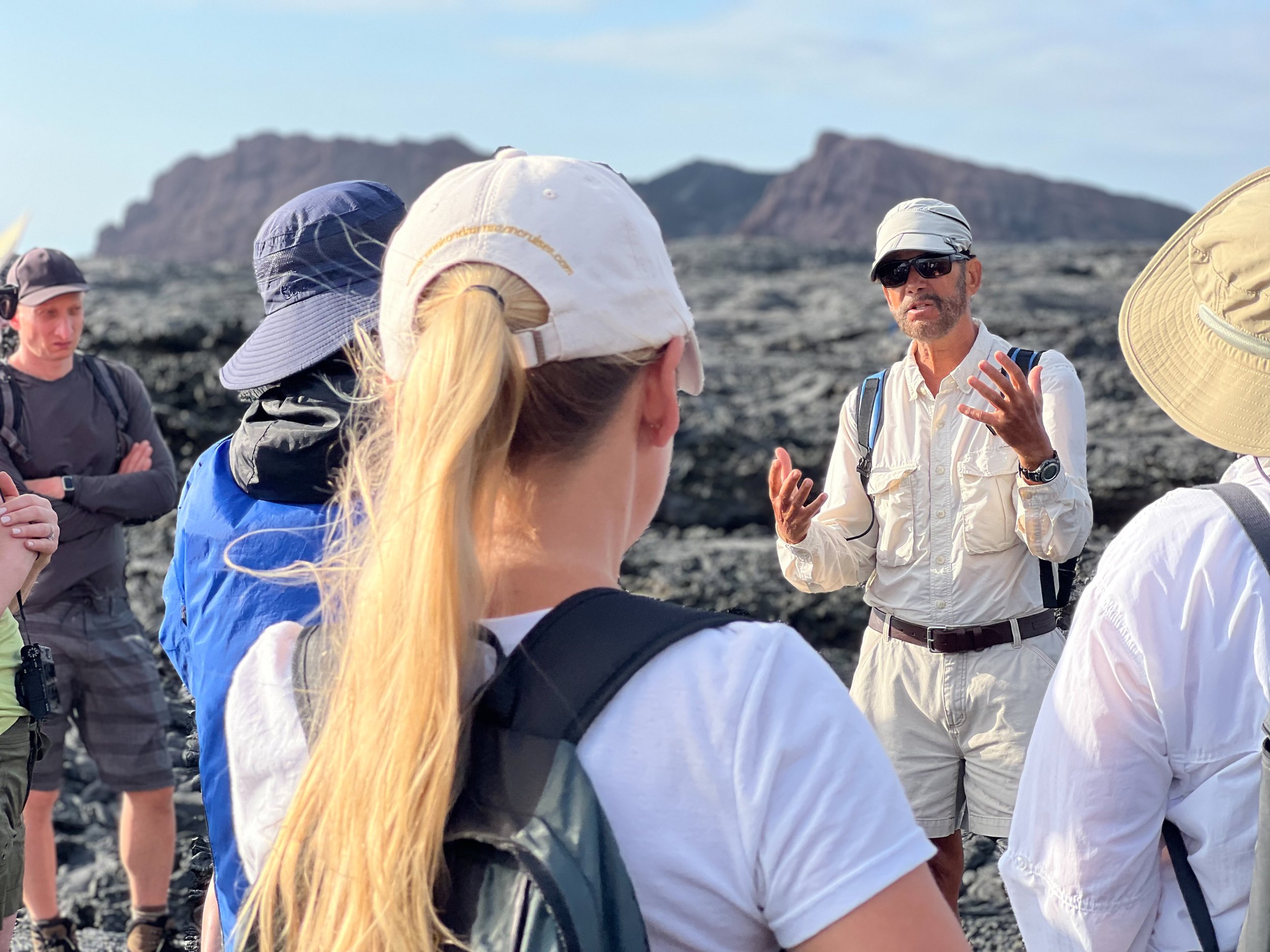 greg-estes-with-guests-on-galapagos-site-visit.jpg