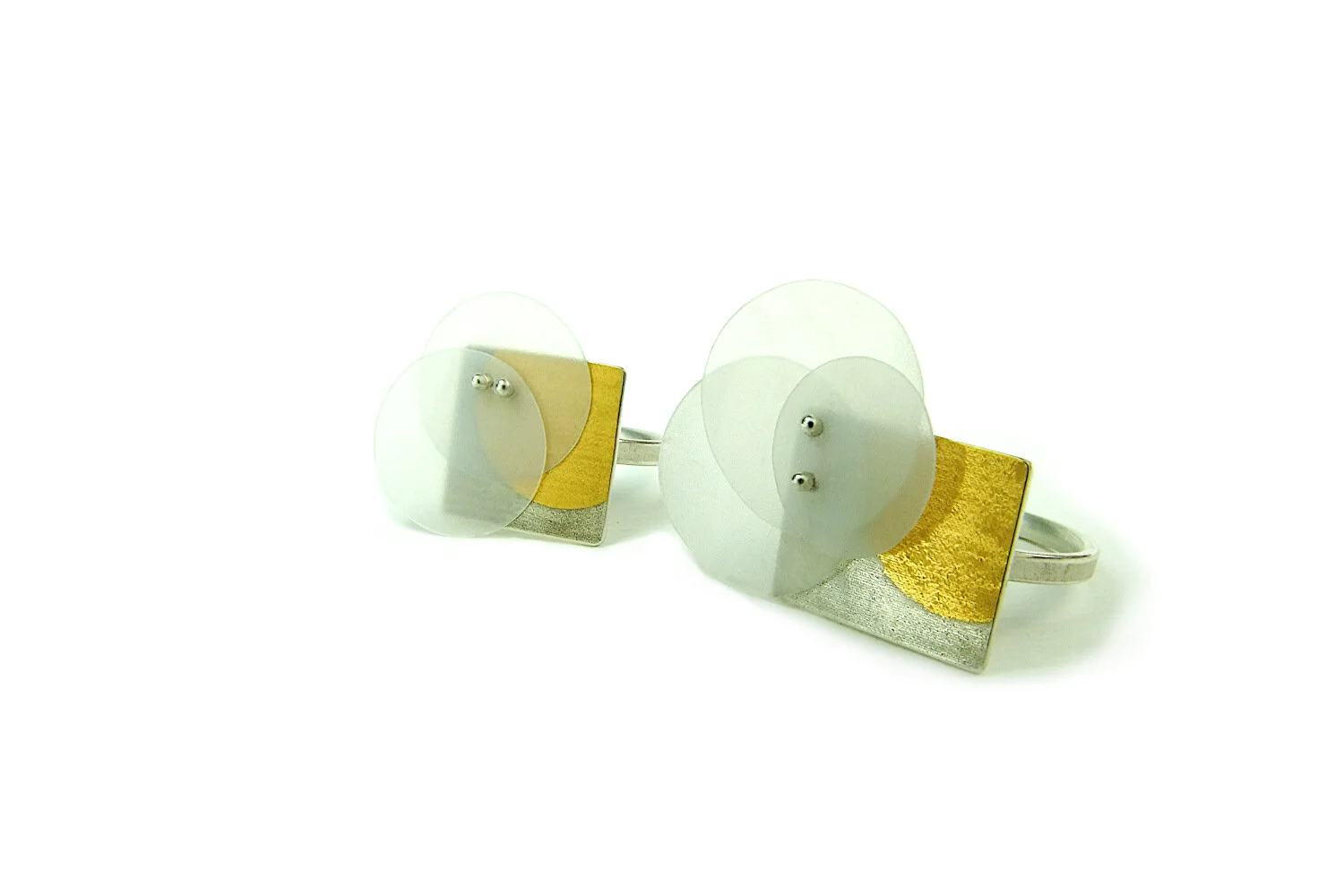 Geometric gold and silver rings with recycled HDPE discs