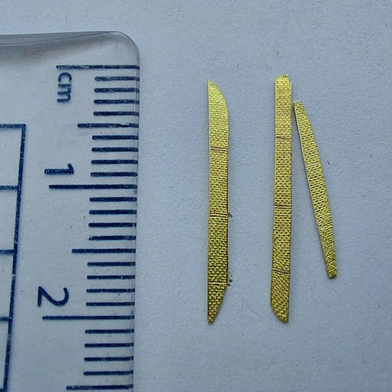 Scale of gold strips before being cut