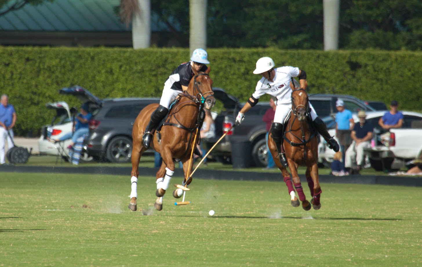 Brothers Nico Pieres of Audi and Gonzalito Pieres of Pilot battle for the ball.