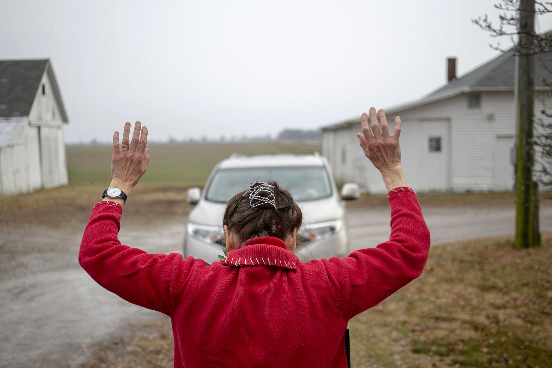 Following tradition, my Great-Aunt Carole Norris-Shortle waves goodbye to departing family members until they are out of view of the Clearview Wissing-Norris farmhouse in Arlington, Ind. The over 100-year-old farmhouse serves as a gathering place for family members at Christmas time and I have never spent a Christmas anywhere else. As the family matriarch, Carole keeps the farmhouse in the family even though it is no longer operational and no one lives in the farmhouse.