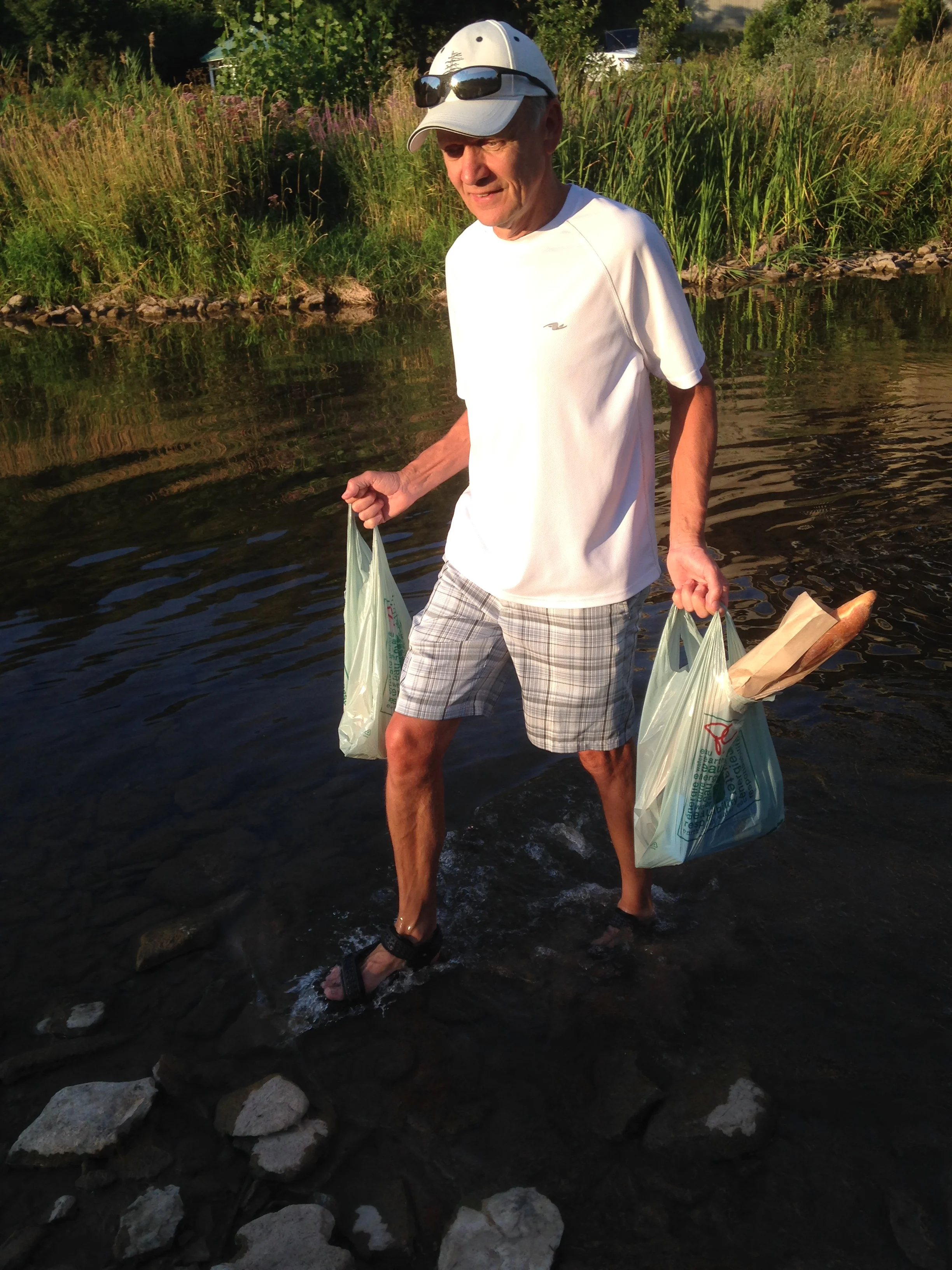Bob in 16 Mile Creek with groceries in hand