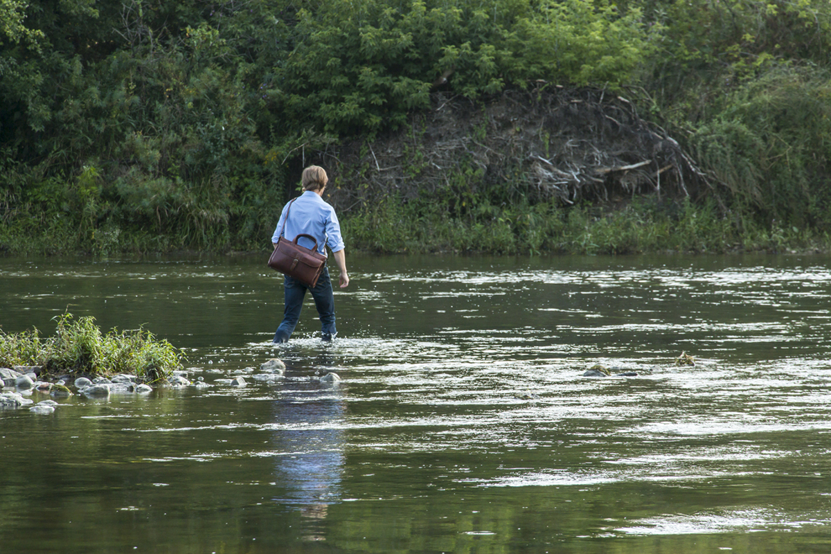 Matthew stepping into the Grand River.
