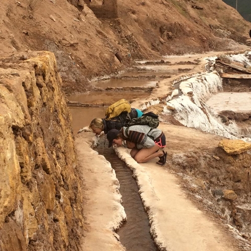 Goofing around and licking the salt mines in Salineras, Peru